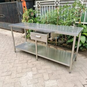 Meja kerja stainless dengan laci dan rak bawah untuk dapur restoran